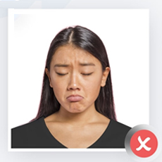 Examples of incorrect facial expressions for ID photos